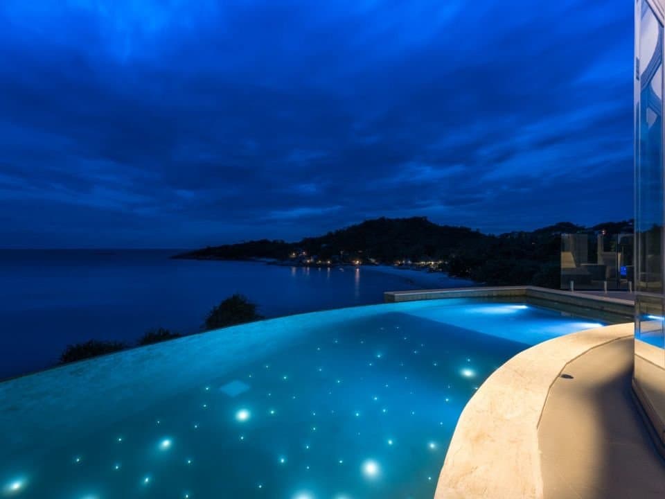 Ocean Front Retreat — The pool against the sea line